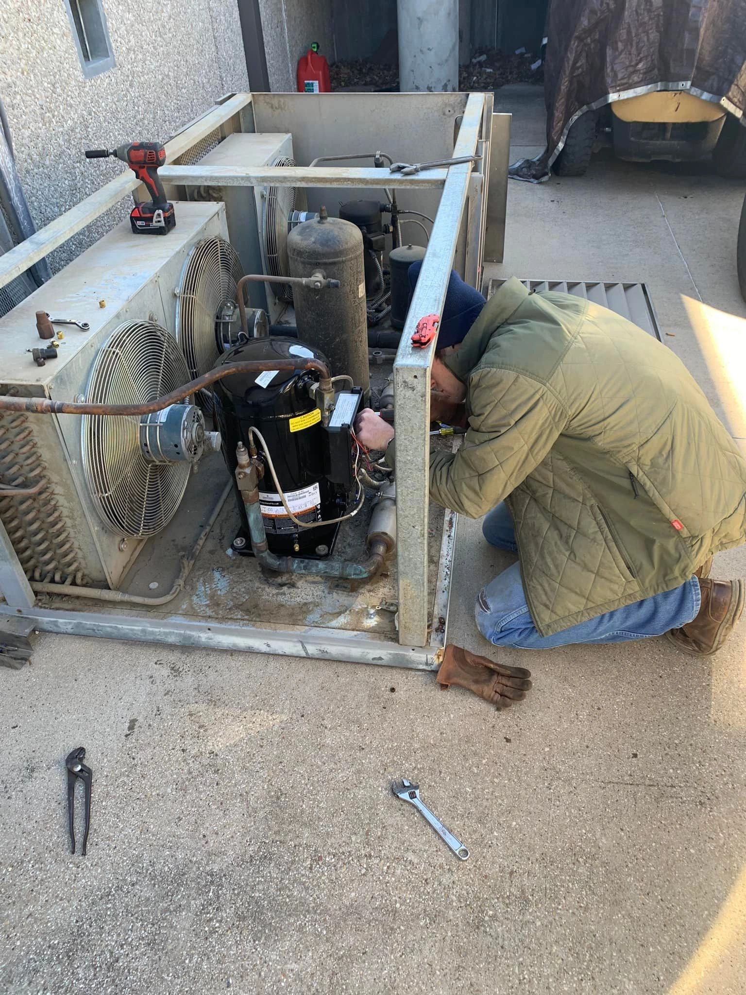 HVAC technician performing a maintenance check